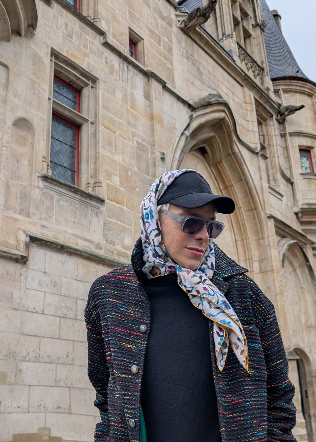 model wearing a silk scarf walking in Paris