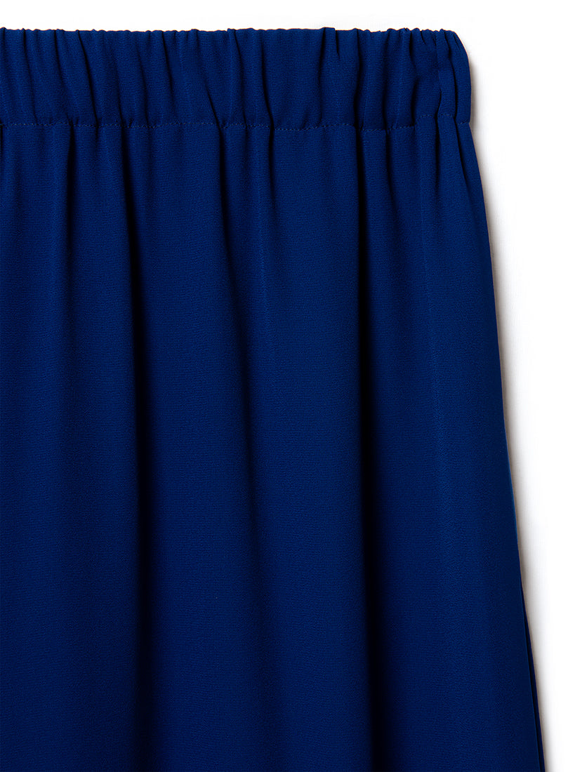 Close-up of a blue silk trousers waits with a white background