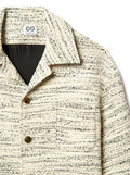 Textured beige jacket with a Infinity by Sammy Voigt brand label on a white background