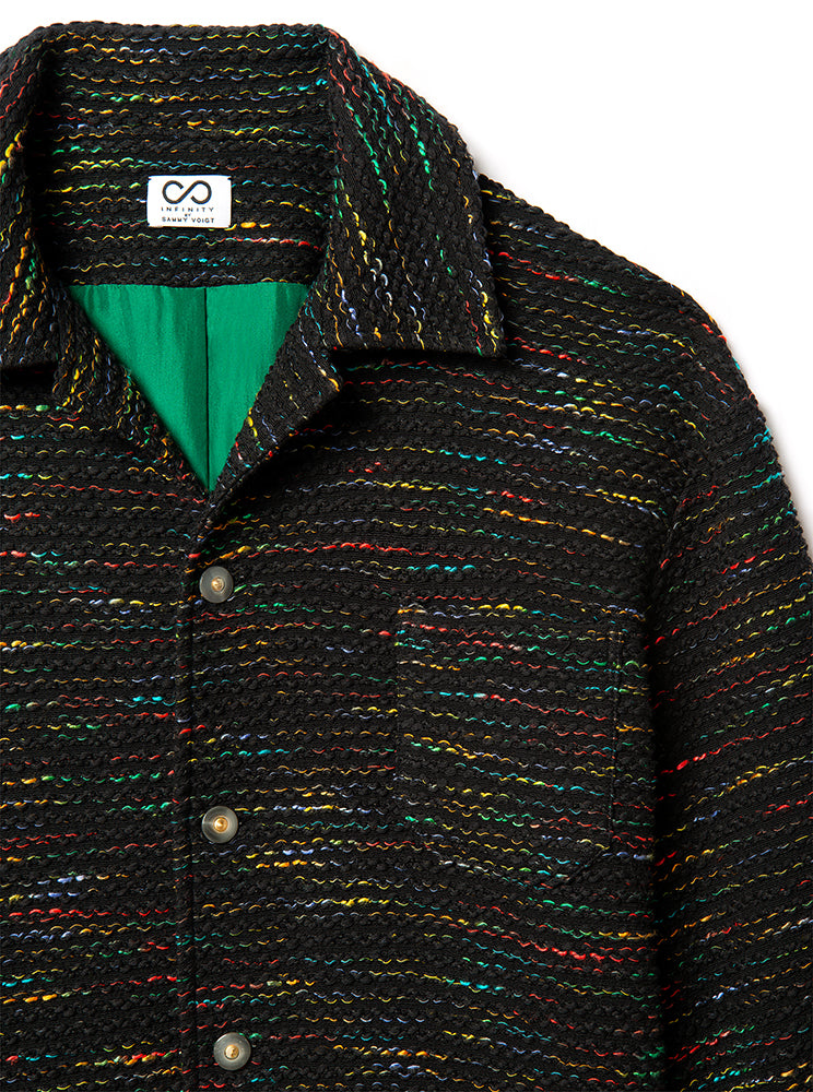 Textured tweed jacket with a green lining and brand logo on a white background