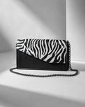 clutch in Zebra motiv and black chain