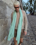 model wears light scarf in light green