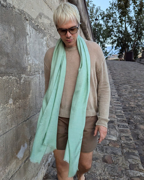 model wears light scarf in light green