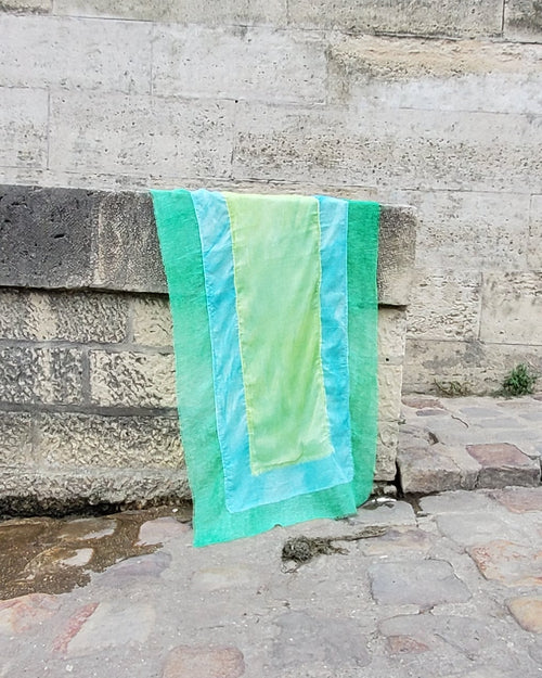 green scarf built in a patchwork rectangular panel in 3 shades of green
