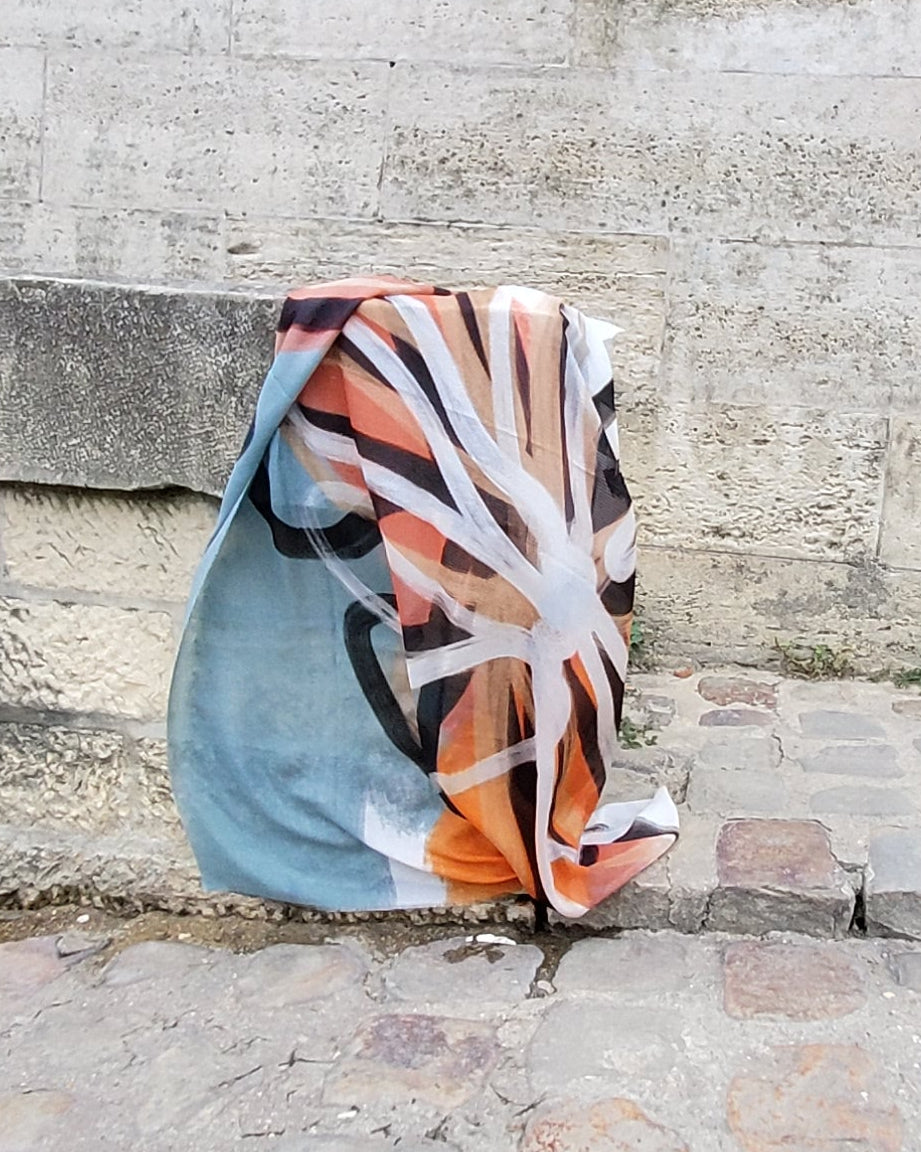 scarf lays down , it has an abstract flower print
