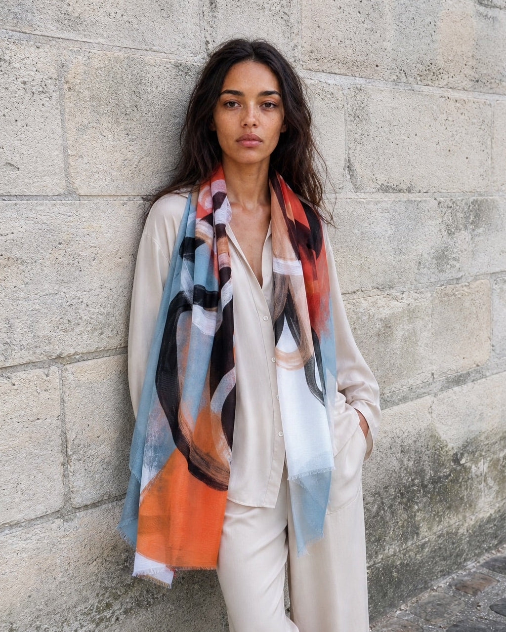 model in light beige look wears printed silk scark with large abstract flower print