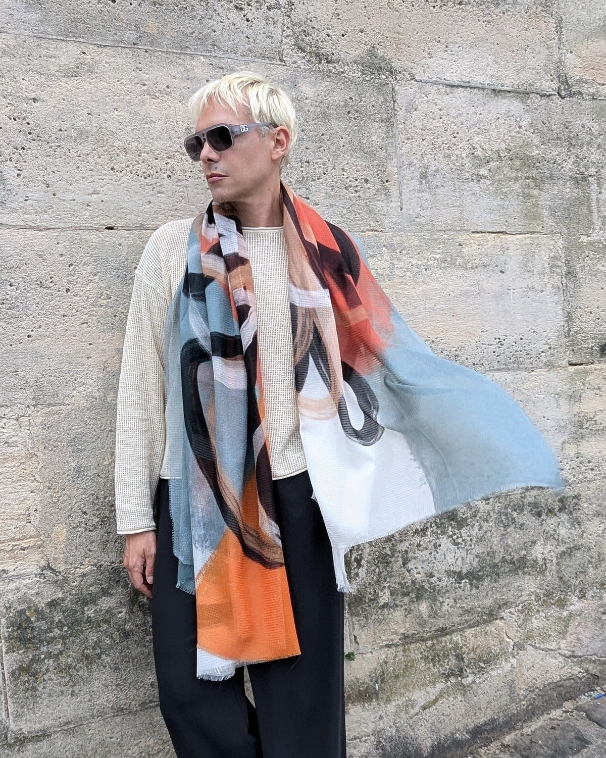 model wears abstract flower large print scarf around the neck