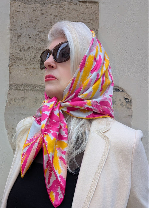 pink and yellow silk foulard on head of the model